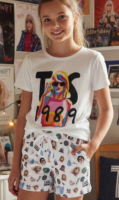 Girls taylor swift white loungewear set with a short sleeve top and drawstring shorts featuring character and text prints.