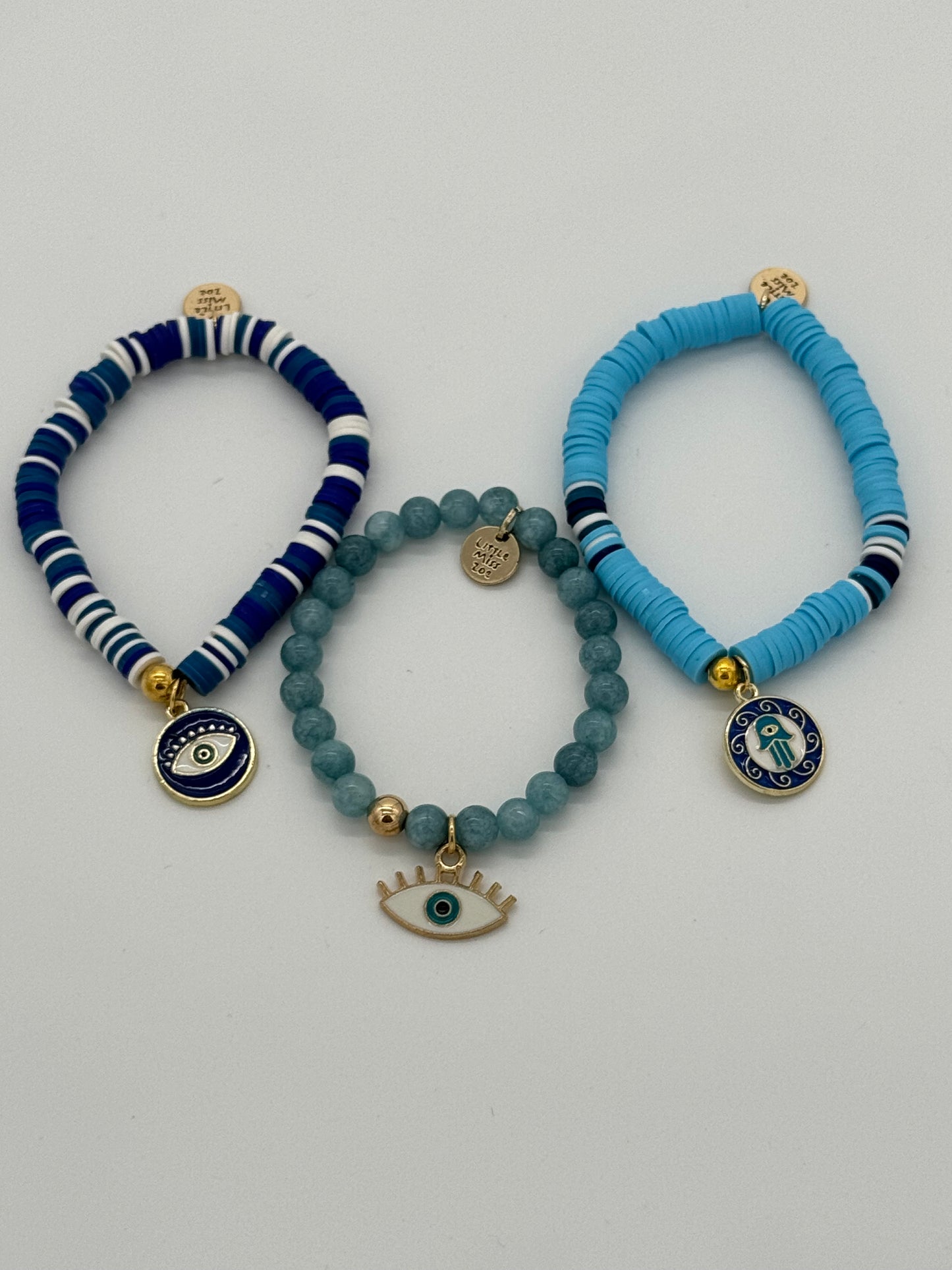 Pulsera navideña con discos de arcilla: Ojo azul